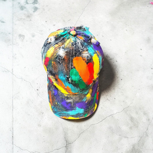 The Rainbow Painted Cap Rebelle Theory