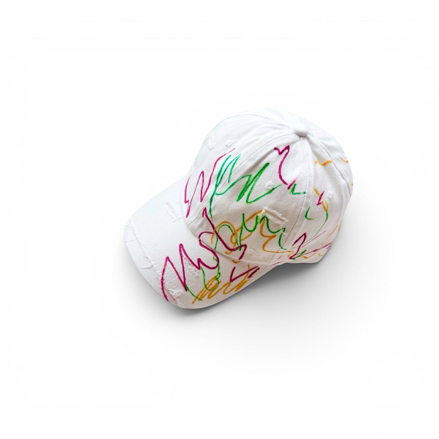 White cap with colorful designs on a white background