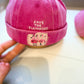 bright pink cap featuring a flamingo design