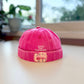 bright pink brimless cap featuring flamingos 