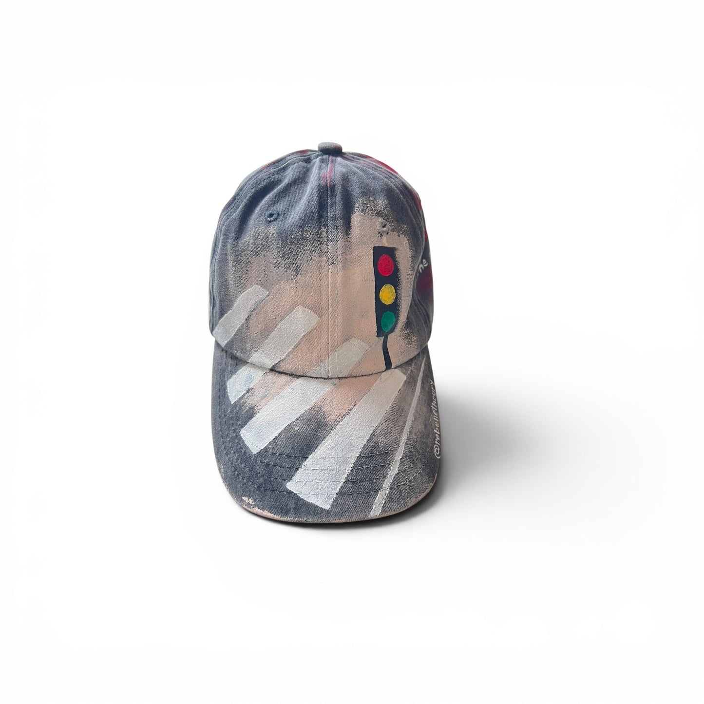 Gray cap with traffic lights painted on a white background